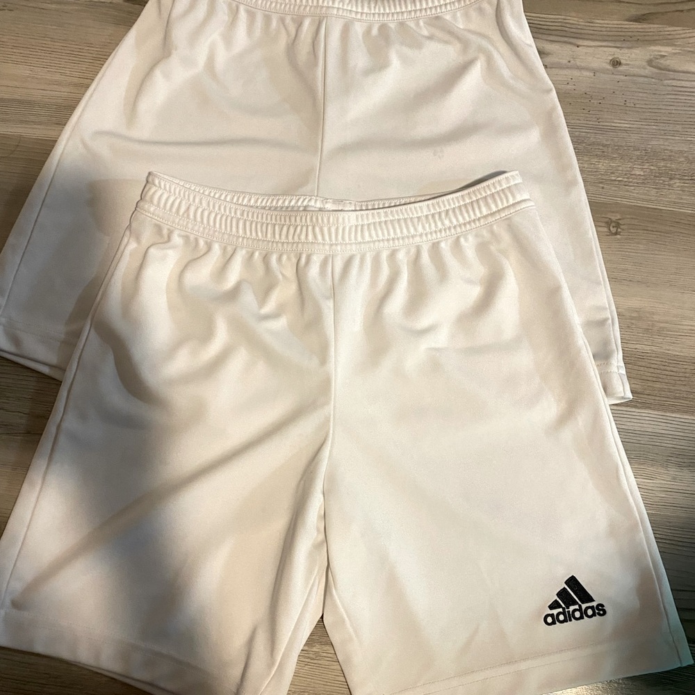 Two pair white adidas sports shorts. Kids size small